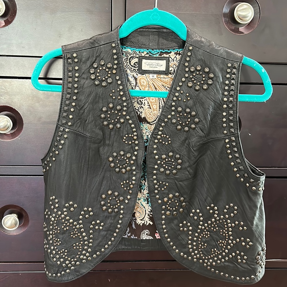 Tasha Polizzi black leather studded vest.